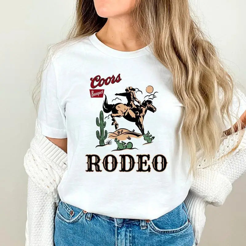 Women’s vintage Coors Western Cowboy T-shirt with faded 90s graphic in a retro western style.